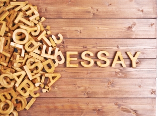 Word essay made with wooden letters